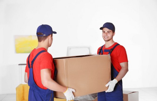 Packed household boxes and furniture ready for transport during a move