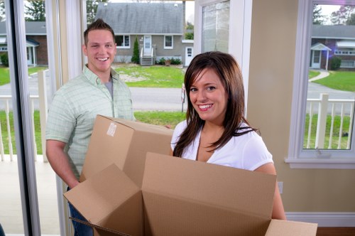 Packed moving boxes and household items ready for house removals in Highbury